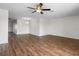 Open-concept living space with modern floors, neutral walls, and a stylish chandelier in the dining area at 1002 Strawpocket Pl, Sun City Center, FL 33573