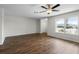 Bright and spacious living room with ceiling fan and a large window offering natural light and street view at 1002 Strawpocket Pl, Sun City Center, FL 33573