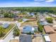 A high angle shot showcasing a neighborhood with mature trees and spacious lots at 10119 Briar Cir, Hudson, FL 34667