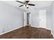 Bright bedroom with neutral walls, modern flooring, and a ceiling fan at 10119 Briar Cir, Hudson, FL 34667