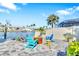 This home offers a beautifully landscaped backyard with pavers, outdoor seating and a fire pit at 1015 Spindle Palm Way, Apollo Beach, FL 33572