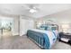 Bedroom with a closet, blue metal bed, and a view into the sitting room at 1015 Spindle Palm Way, Apollo Beach, FL 33572