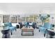 Bright sunroom with plush seating, offering serene views and a relaxing atmosphere at 1015 Spindle Palm Way, Apollo Beach, FL 33572