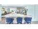 Kitchen with quartz countertops, seating for three, and open to the dining and living areas at 1015 Spindle Palm Way, Apollo Beach, FL 33572