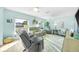 Cozy living room with plenty of natural light, ceiling fans, and comfortable seating at 1015 Spindle Palm Way, Apollo Beach, FL 33572