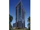 Striking exterior of a high-rise building showcasing modern design, expansive glass windows, and balconies with city views at 1101 E Jackson St # 2519, Tampa, FL 33602