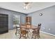 Comfortable dining area with wooden table, chairs, and natural light creates a warm atmosphere at 11257 Persimmon Ave, Weeki Wachee, FL 34614