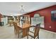 Dining area with hardwood floors offers open layout and views of the connected kitchen at 11257 Persimmon Ave, Weeki Wachee, FL 34614