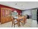 Charming dining room features hardwood floors, dining table and chairs, and a built-in display cabinet at 11257 Persimmon Ave, Weeki Wachee, FL 34614