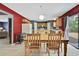 Dining room features hardwood floors and offers open layout to kitchen and stairs at 11257 Persimmon Ave, Weeki Wachee, FL 34614
