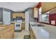 Efficient kitchen layout with modern appliances, countertops, and ample storage at 11257 Persimmon Ave, Weeki Wachee, FL 34614