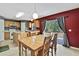 Bright kitchen and dining area with wood cabinets, island, and access to the backyard at 11257 Persimmon Ave, Weeki Wachee, FL 34614