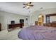 Bright primary bedroom featuring a ceiling fan, light floors, and neutral color scheme at 11257 Persimmon Ave, Weeki Wachee, FL 34614
