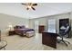 Comfortable primary bedroom featuring a ceiling fan and an abundance of natural light at 11257 Persimmon Ave, Weeki Wachee, FL 34614