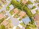 Aerial view of homes in a lush community showing mature trees and landscaping at 11284 Hickory Ridge Ct, Spring Hill, FL 34609