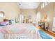 Spacious bedroom with vaulted ceilings, plush bedding, and an abundance of natural light at 11284 Hickory Ridge Ct, Spring Hill, FL 34609