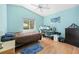 Bedroom featuring a desk, vaulted ceiling, and warm natural lighting at 11284 Hickory Ridge Ct, Spring Hill, FL 34609