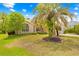 Charming single-story home with a well-manicured front yard and mature trees at 11284 Hickory Ridge Ct, Spring Hill, FL 34609