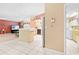 View of kitchen features with white tile floors and adjacent laundry room at 11284 Hickory Ridge Ct, Spring Hill, FL 34609