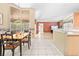 View of the kitchen and dining area featuring tile flooring and natural light at 11284 Hickory Ridge Ct, Spring Hill, FL 34609