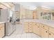 An open kitchen design features tile flooring and stainless steel refrigerator at 11284 Hickory Ridge Ct, Spring Hill, FL 34609