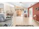 Bright living room with tile flooring, cozy seating and view into dining room and lanai at 11284 Hickory Ridge Ct, Spring Hill, FL 34609
