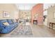 Spacious living room featuring vaulted ceilings, neutral walls, wood-look floors, and abundant natural light at 11284 Hickory Ridge Ct, Spring Hill, FL 34609