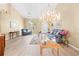 Inviting living room featuring high ceilings, large windows, stylish decor, and attractive light flooring at 11284 Hickory Ridge Ct, Spring Hill, FL 34609