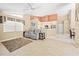 Open living area with neutral walls, tile flooring, and comfortable seating at 11284 Hickory Ridge Ct, Spring Hill, FL 34609