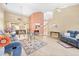 Bright and spacious living room with high ceilings, wood-look floors, and access to the screened patio at 11284 Hickory Ridge Ct, Spring Hill, FL 34609