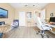 Office with neutral walls and flooring, complemented by a desk and comfortable chair at 11284 Hickory Ridge Ct, Spring Hill, FL 34609