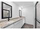 Bathroom featuring double vanity, granite countertops, and modern fixtures at 124 Hallam Ct, Spring Hill, FL 34606