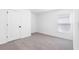 Clean bedroom with plush carpet, neutral walls, and natural light at 124 Hallam Ct, Spring Hill, FL 34606