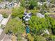 Aerial view of a home with solar panels, mature landscaping, and a backyard pool at 125 29Th N St, St Petersburg, FL 33713