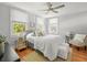 Inviting bedroom with large windows, hardwood floors, and neutral decor at 125 29Th N St, St Petersburg, FL 33713