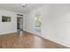 Bonus room features wood-look tile flooring and a door leading to the pool area at 125 29Th N St, St Petersburg, FL 33713