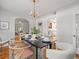 Dining room featuring a modern chandelier, a long table, and light walls at 125 29Th N St, St Petersburg, FL 33713