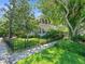 Charming home with a fenced yard, lush landscaping, and a well-manicured lawn at 125 29Th N St, St Petersburg, FL 33713