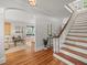 Spacious foyer boasts a staircase and gleaming hardwood floors that flow into the living spaces at 125 29Th N St, St Petersburg, FL 33713