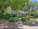 Charming home featuring manicured landscaping, a brick walkway, and a well-maintained lawn at 125 29Th N St, St Petersburg, FL 33713