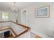 Second floor hallway with chandelier and natural light at 125 29Th N St, St Petersburg, FL 33713