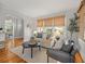 Comfortable living room featuring neutral furniture, woven blinds, and bright natural light at 125 29Th N St, St Petersburg, FL 33713