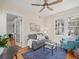 Inviting living room with neutral color palette, wood floors, and French doors at 125 29Th N St, St Petersburg, FL 33713
