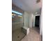 Sleek bathroom with glass enclosed shower, built-in bench, and modern lighting at 17122 Moonflower Dr, Venice, FL 34293