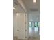 Bright, open-concept living room featuring tile floors and abundant natural light at 17122 Moonflower Dr, Venice, FL 34293