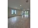 Spacious living area with tile flooring, recessed lighting, and access to the backyard at 17122 Moonflower Dr, Venice, FL 34293