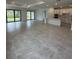 Bright and spacious open-concept living area connecting to a kitchen at 17122 Moonflower Dr, Venice, FL 34293