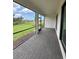 Wide, screened patio featuring brick flooring with a view of neighboring houses and green space at 17122 Moonflower Dr, Venice, FL 34293