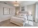 Inviting bedroom with a well-lit interior, a decorative headboard and stylish bedding at 17146 Moonflower Dr, Venice, FL 34293