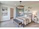 Stylish bedroom features a metal bed frame, modern decor, and a cozy atmosphere at 17146 Moonflower Dr, Venice, FL 34293